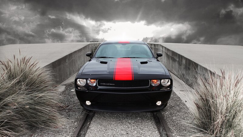 Black Dodge Challenger on a bridge