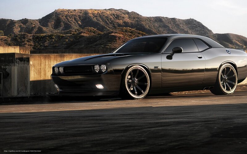 Black Dodge Challenger on a bridge