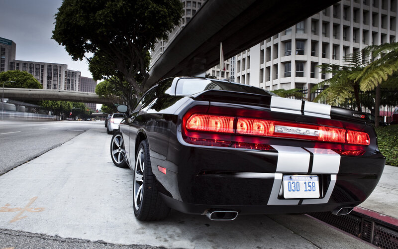 Black Dodge Challenger on city street