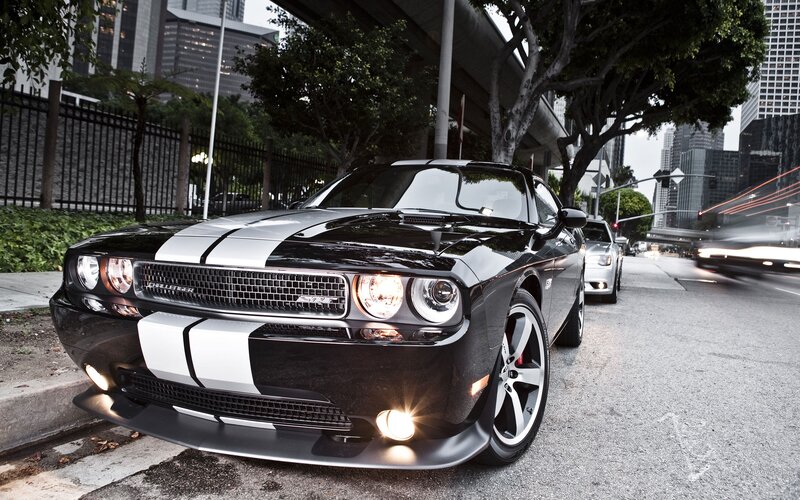 Black Dodge Challenger on city street