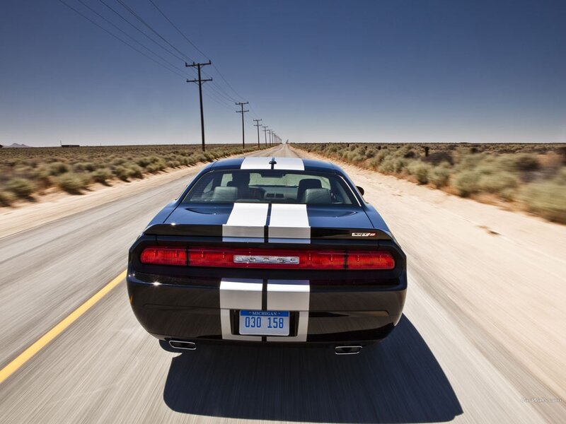 black dodge challenger on desert road