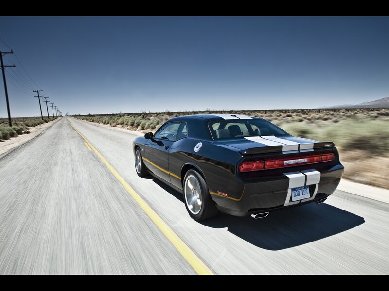 black dodge challenger on desert road