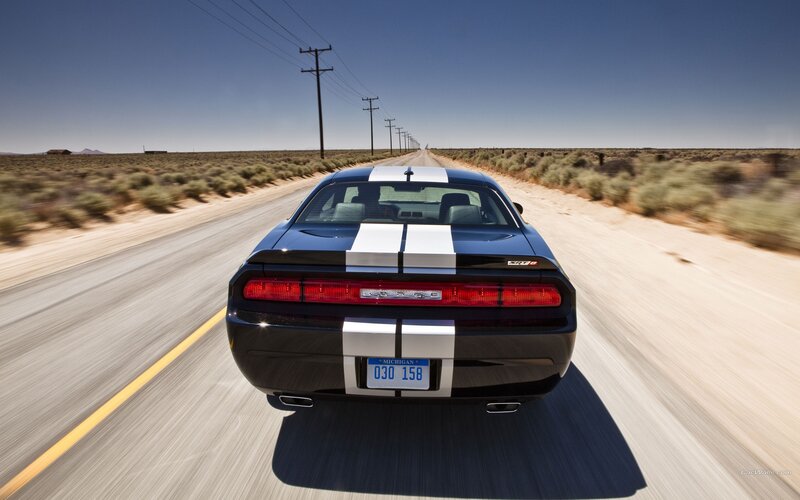 black dodge challenger on desert road