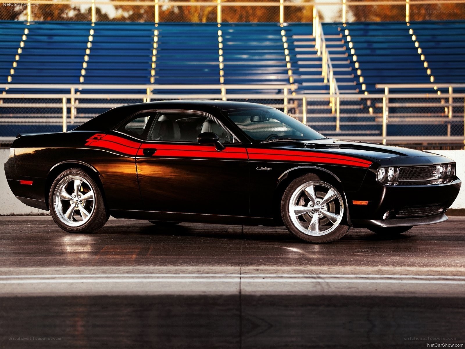 Black Dodge Challenger on racetrack