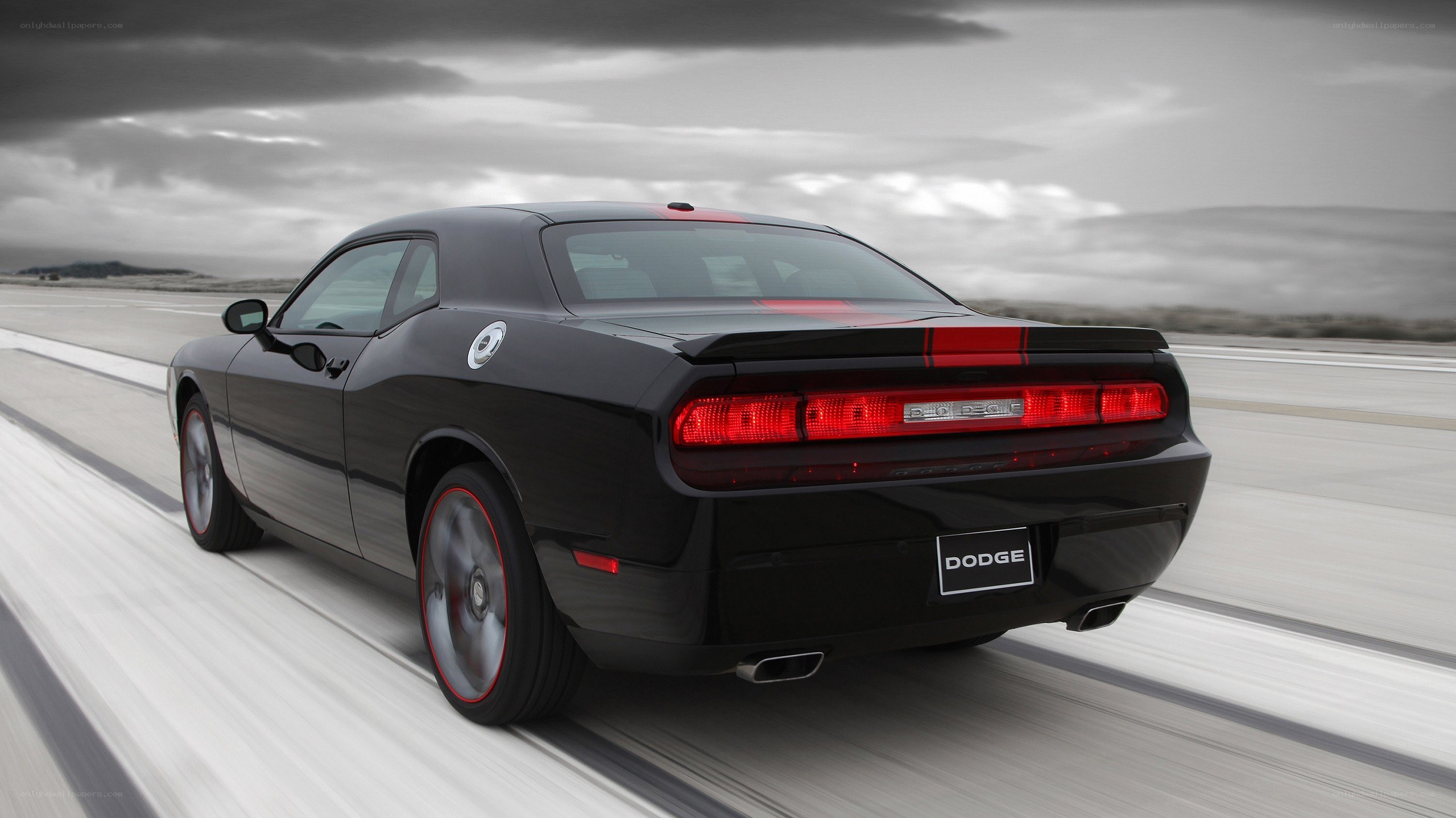 black dodge challenger on track