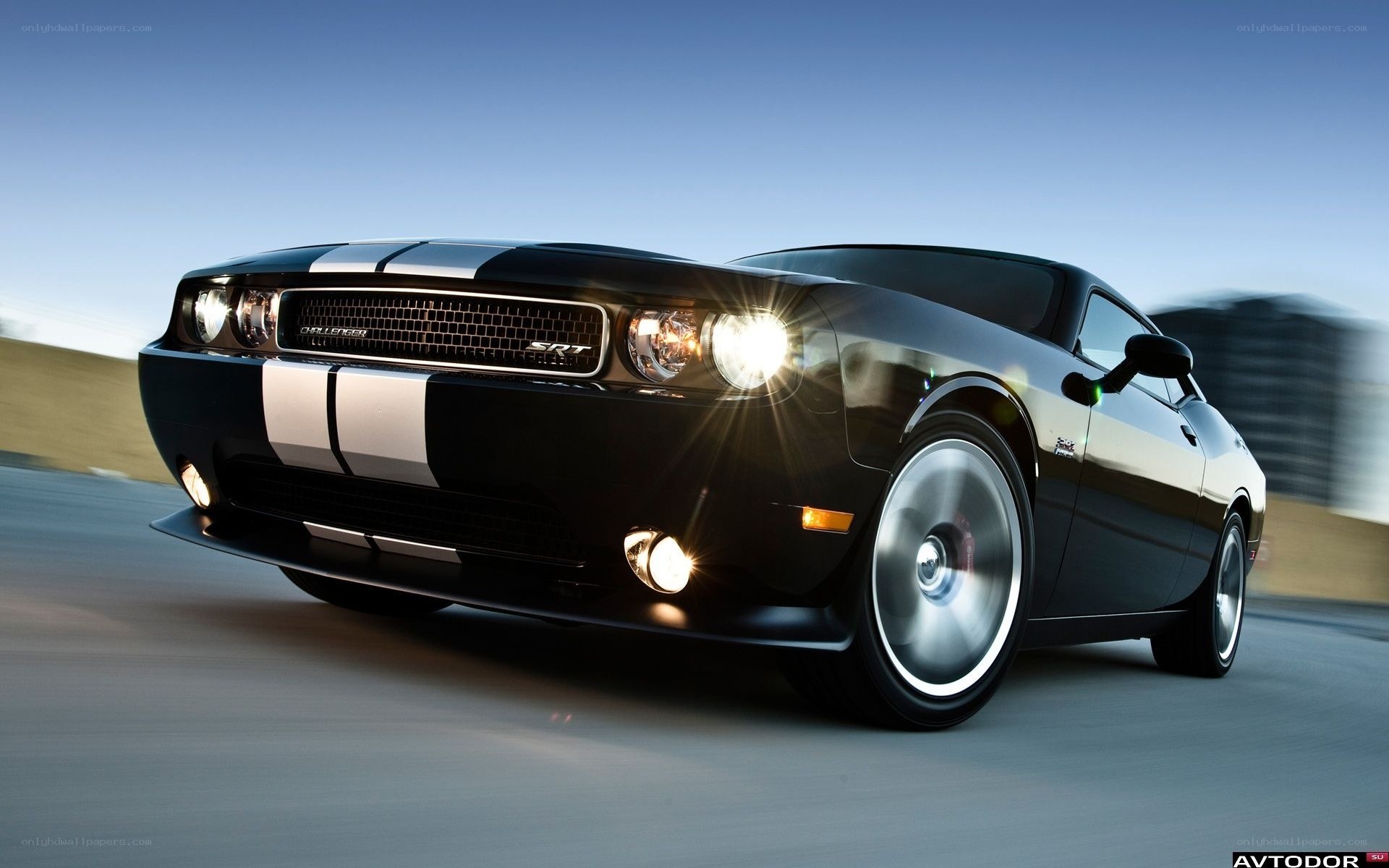 Black Dodge Challenger SRT in motion