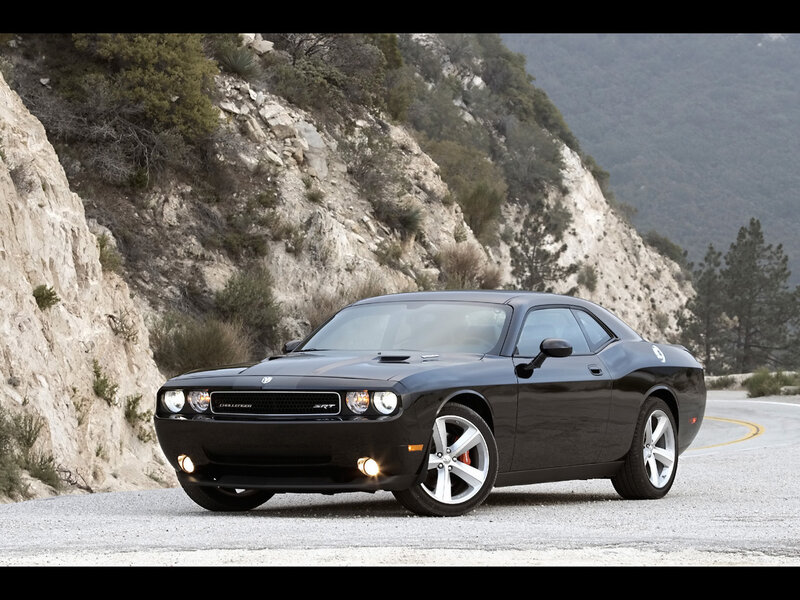 Black Dodge Challenger SRT on mountain road