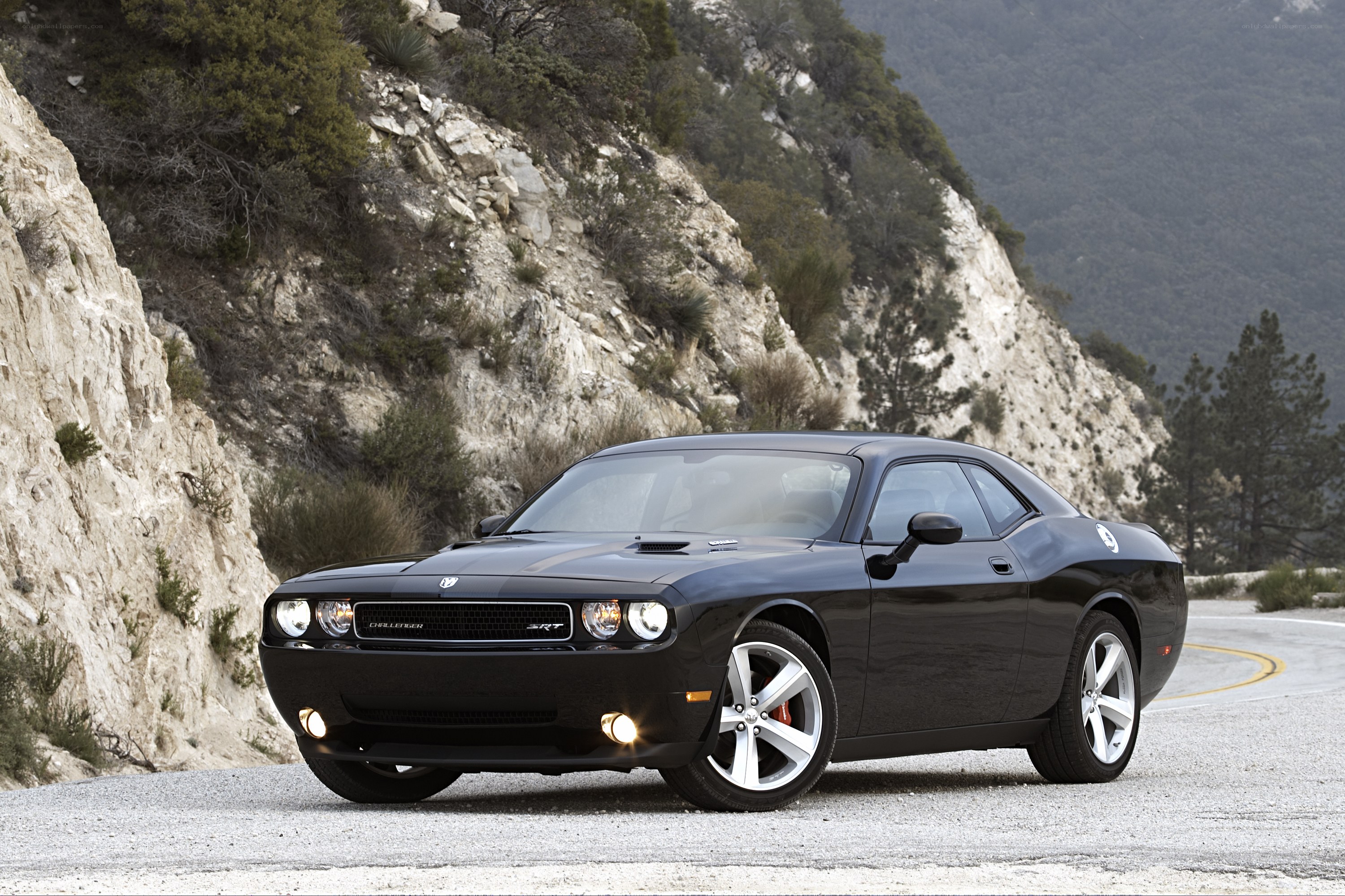 Black Dodge Challenger SRT on mountain road