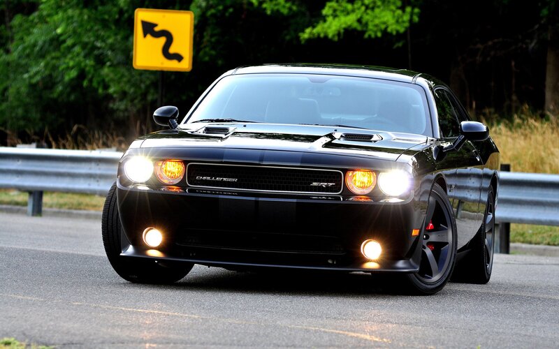 Black Dodge Challenger SRT on road