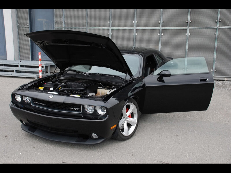 Black Dodge Challenger SRT with open hood