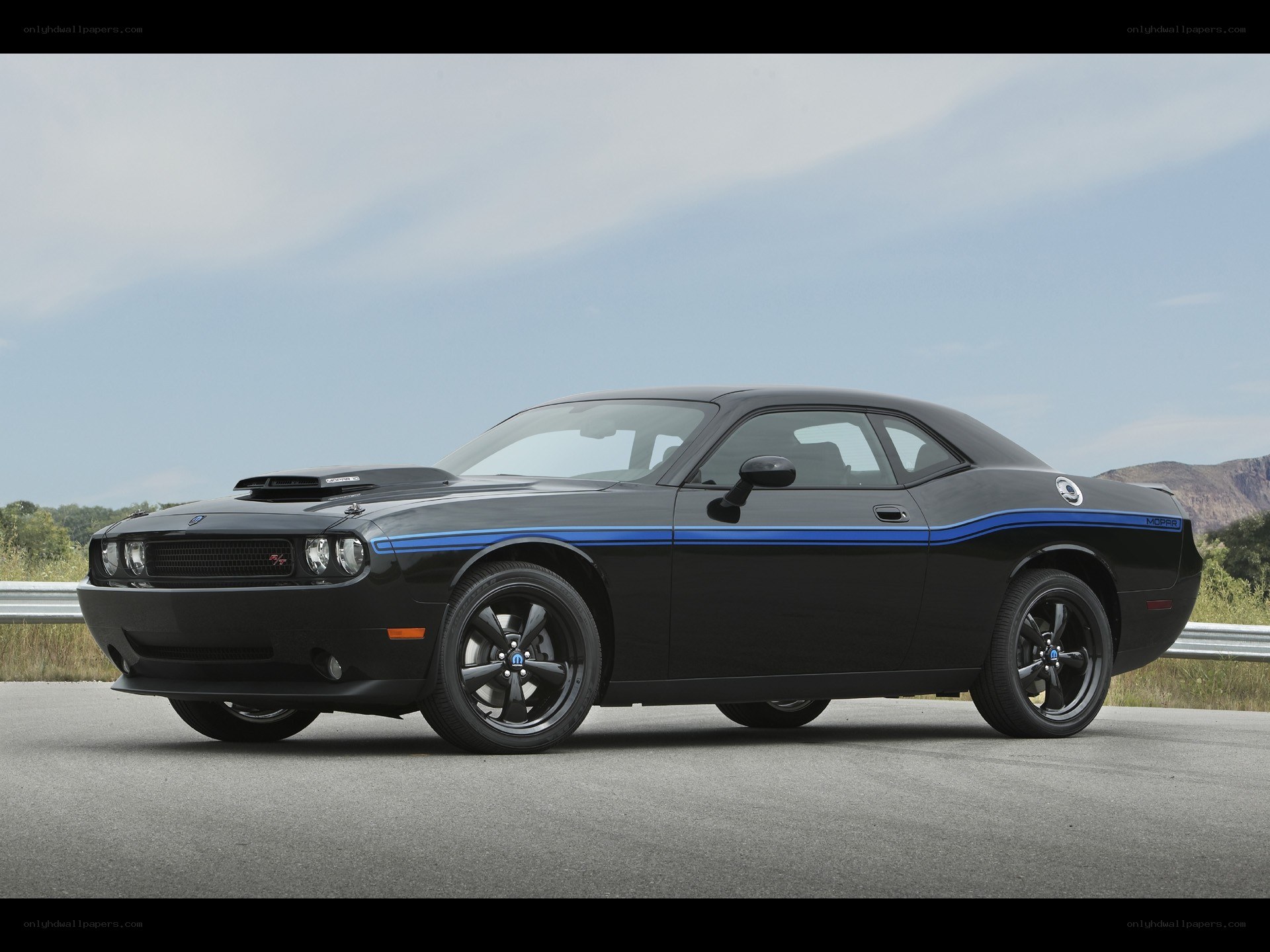 Black Dodge Challenger with blue stripes