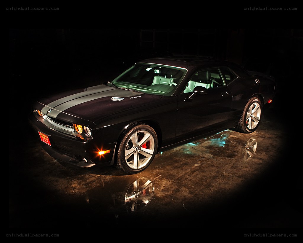black dodge challenger with racing stripes