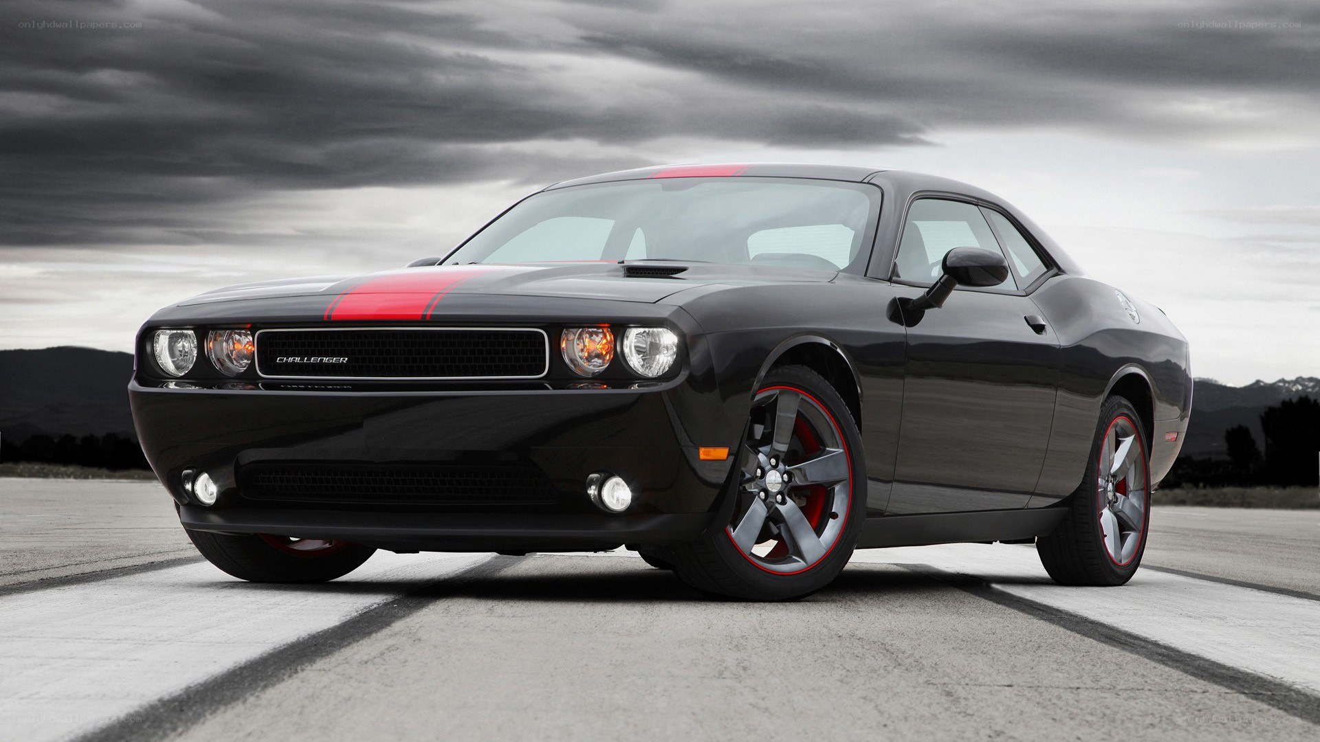 Black Dodge Challenger with red stripes