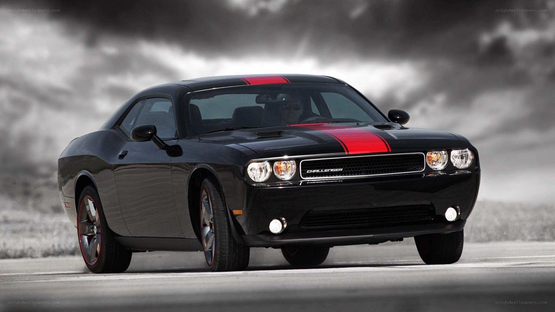 Black Dodge Challenger with red stripes