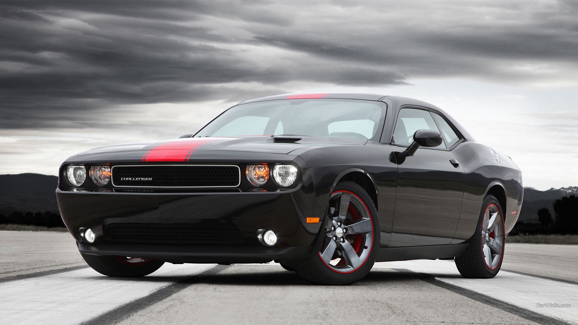 black dodge challenger with red stripes