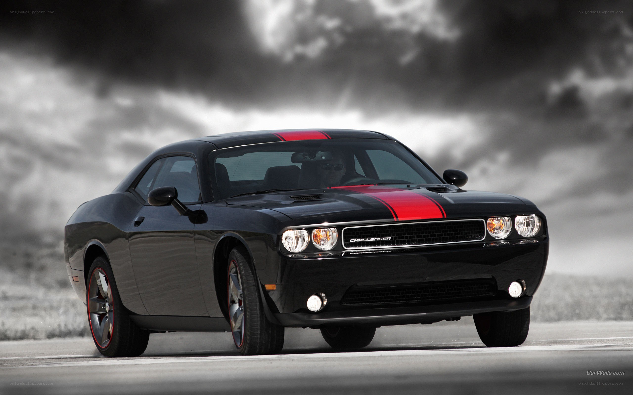Black Dodge Challenger with red stripes