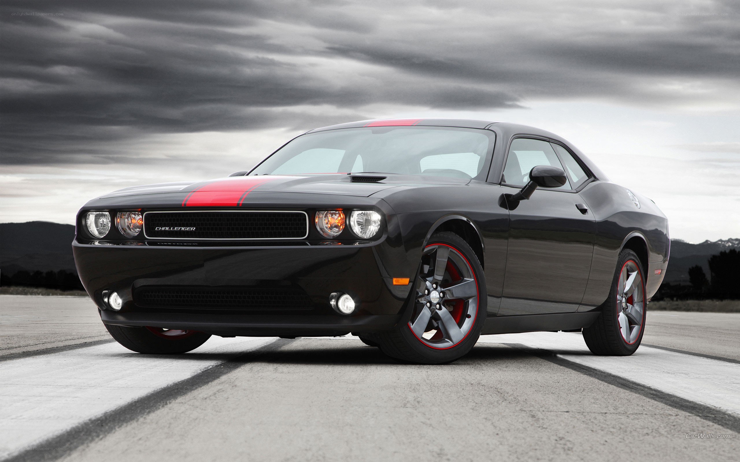 Black Dodge Challenger with red stripes