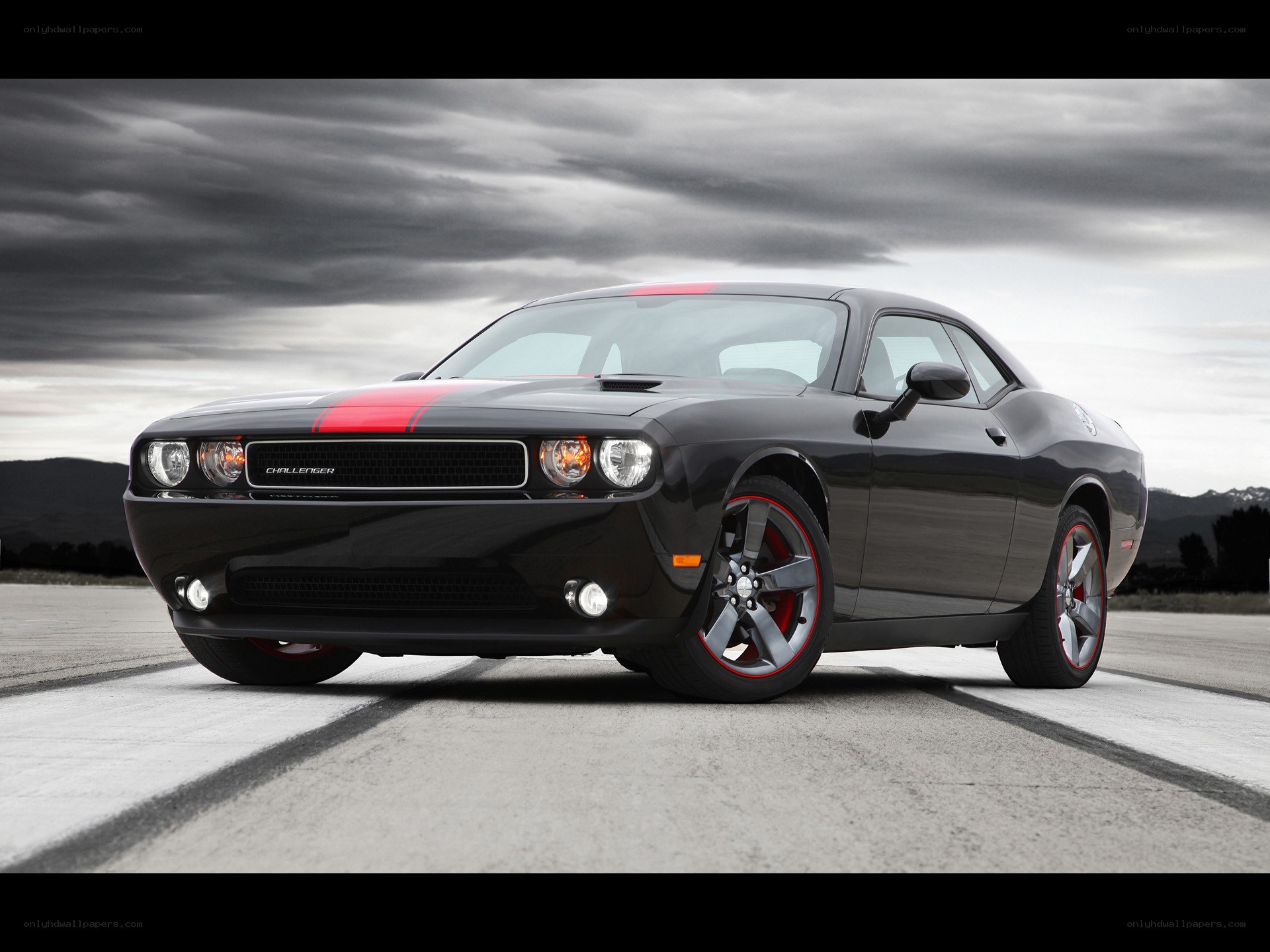 Black Dodge Challenger with red stripes