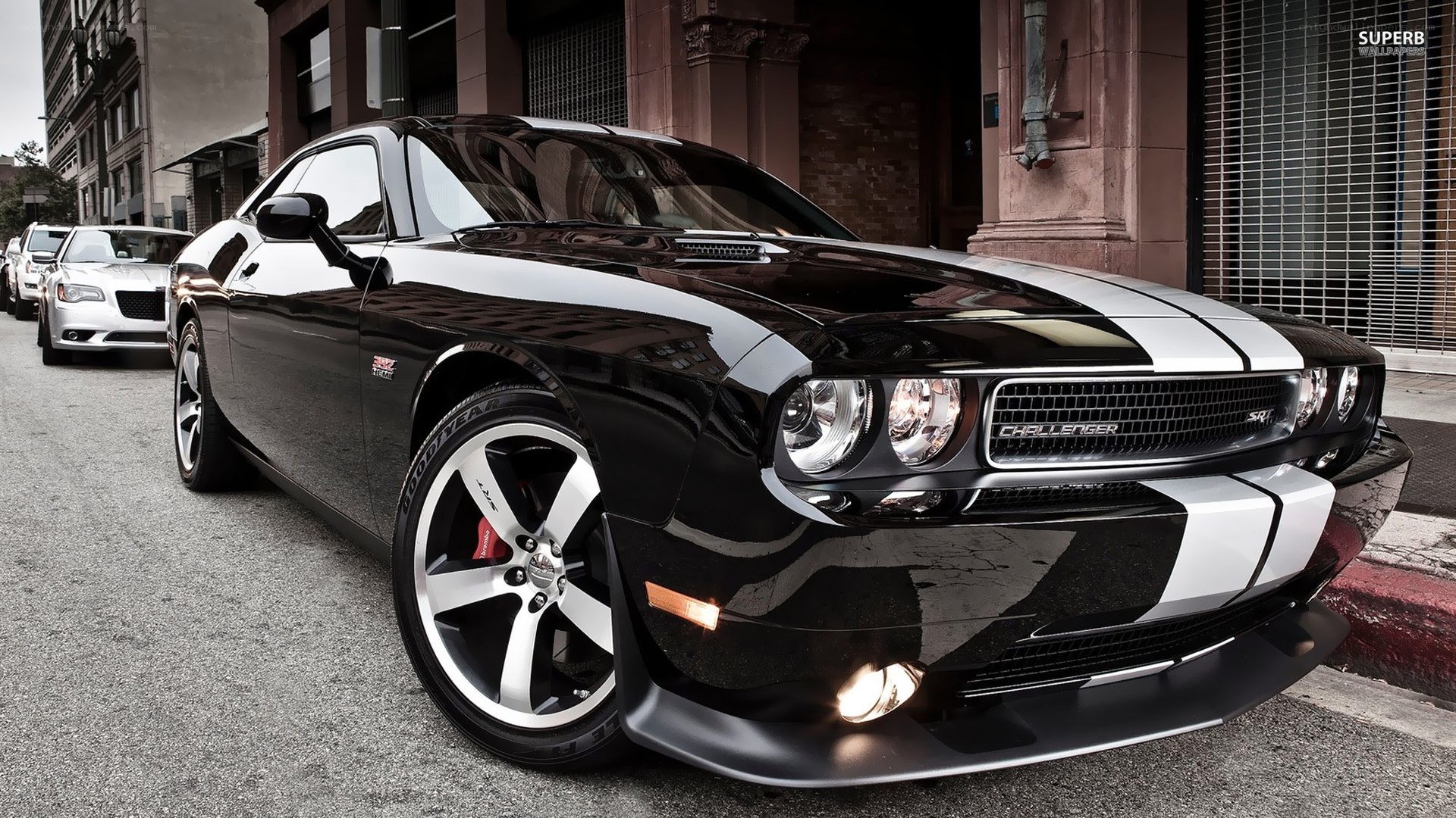 Black Dodge Challenger with stripes