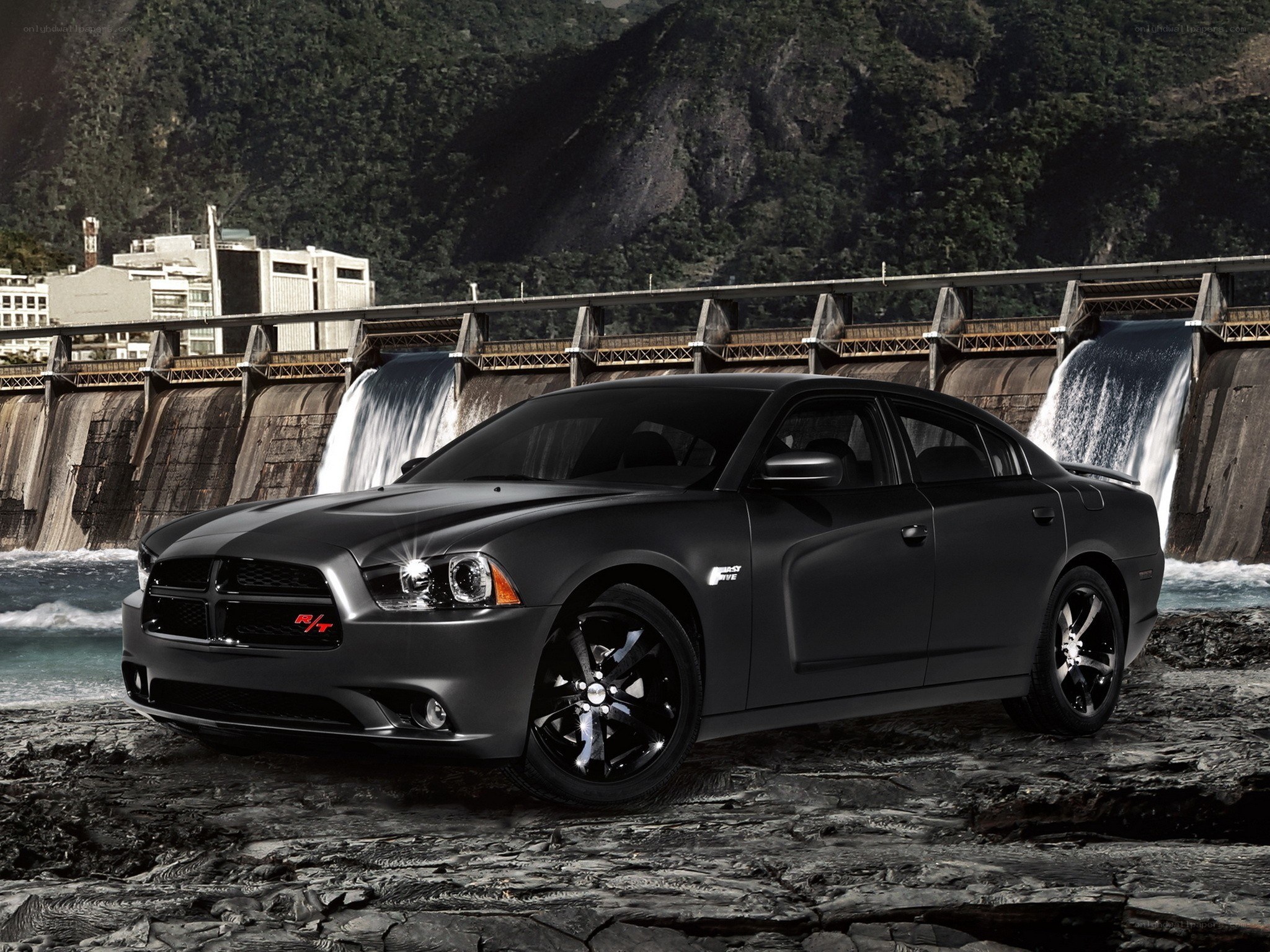 Black Dodge Charger at a dam