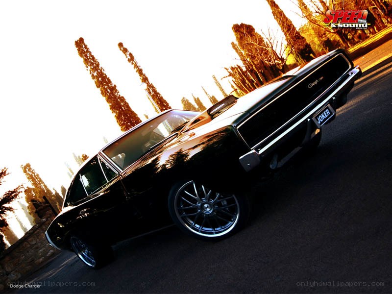 Black Dodge Charger at sunset