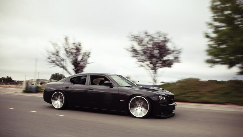 black dodge charger in motion
