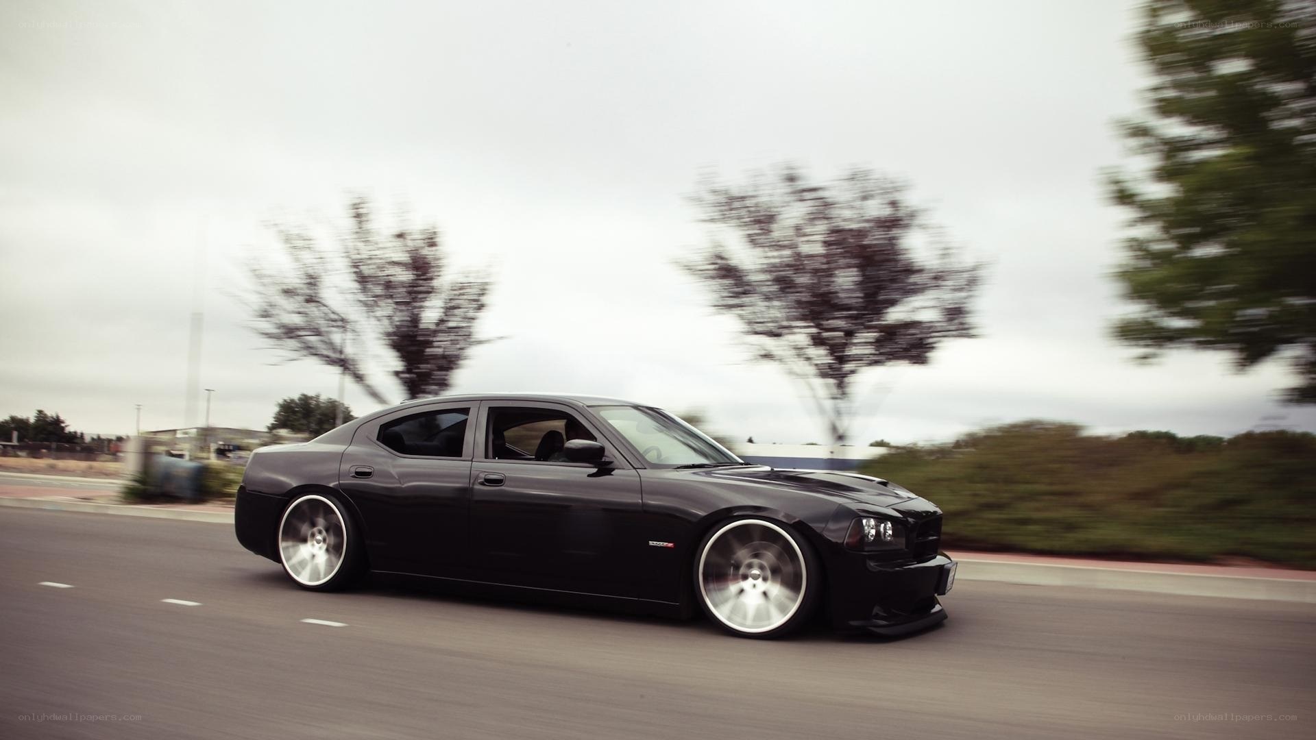 black dodge charger in motion