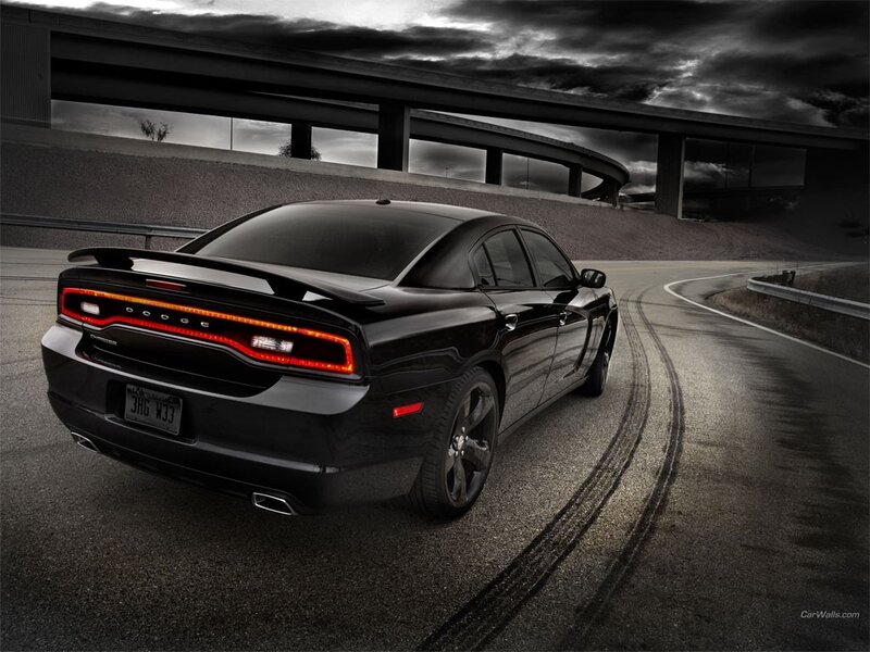Black Dodge Charger on a winding road
