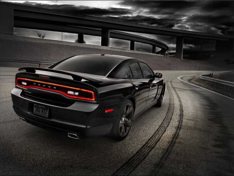 Black Dodge Charger on a winding road