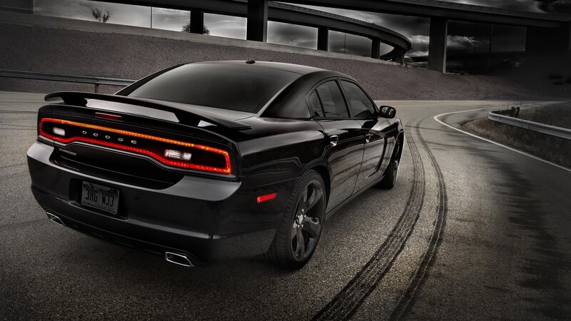 Black Dodge Charger on a winding road