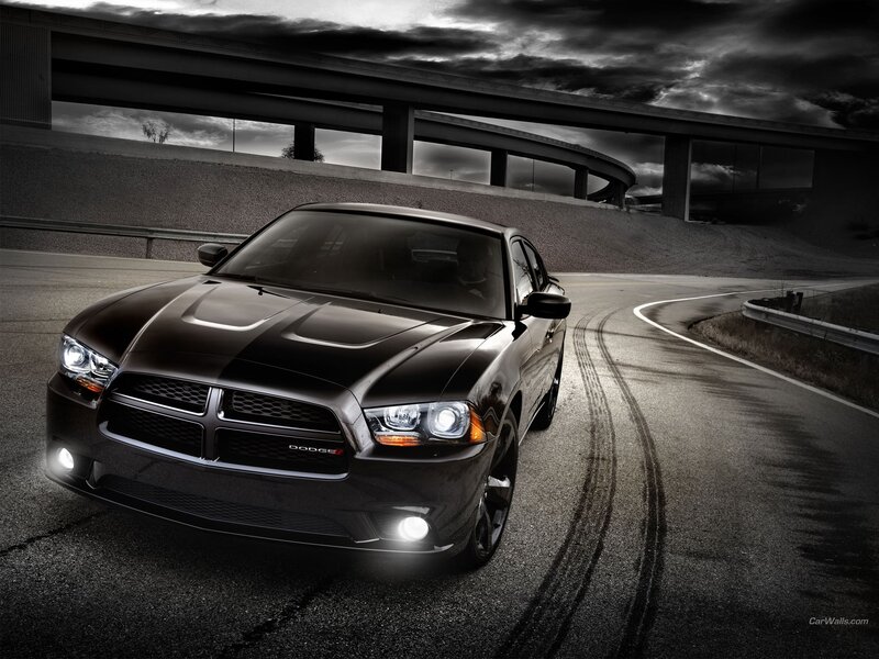 Black Dodge Charger on a winding road