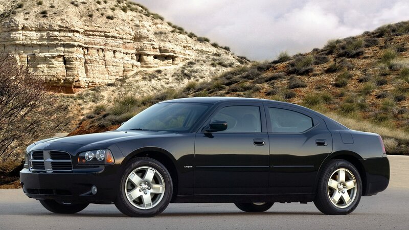 black dodge charger on desert road