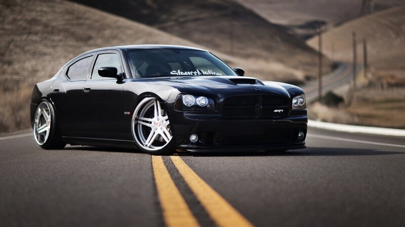 black dodge charger on road