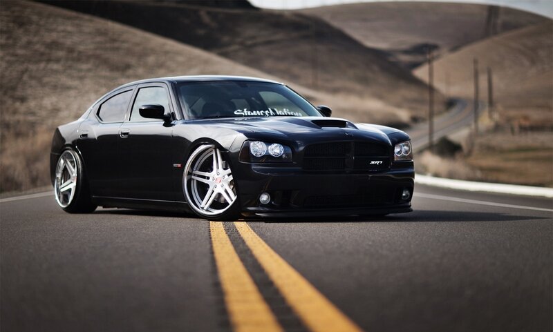 black dodge charger on road