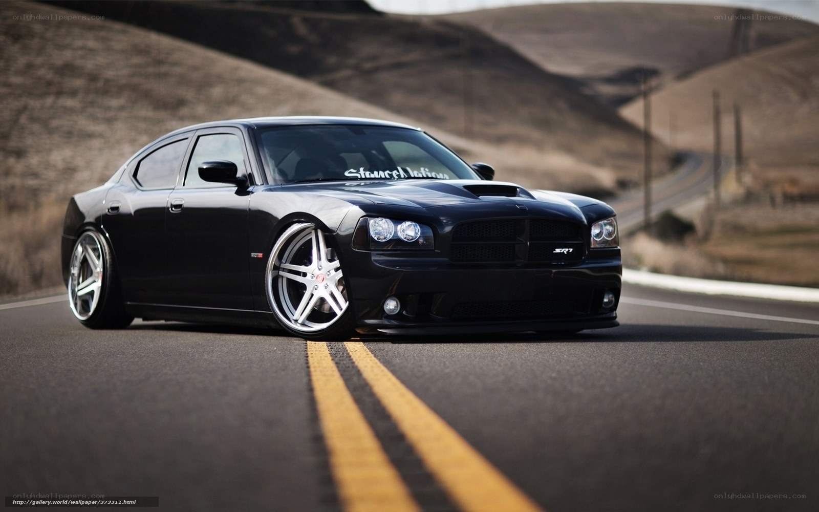 black dodge charger srt on road