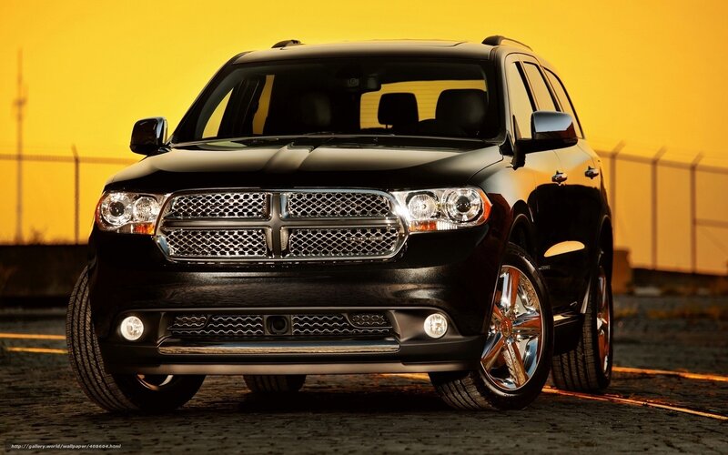Black Dodge Durango at sunset