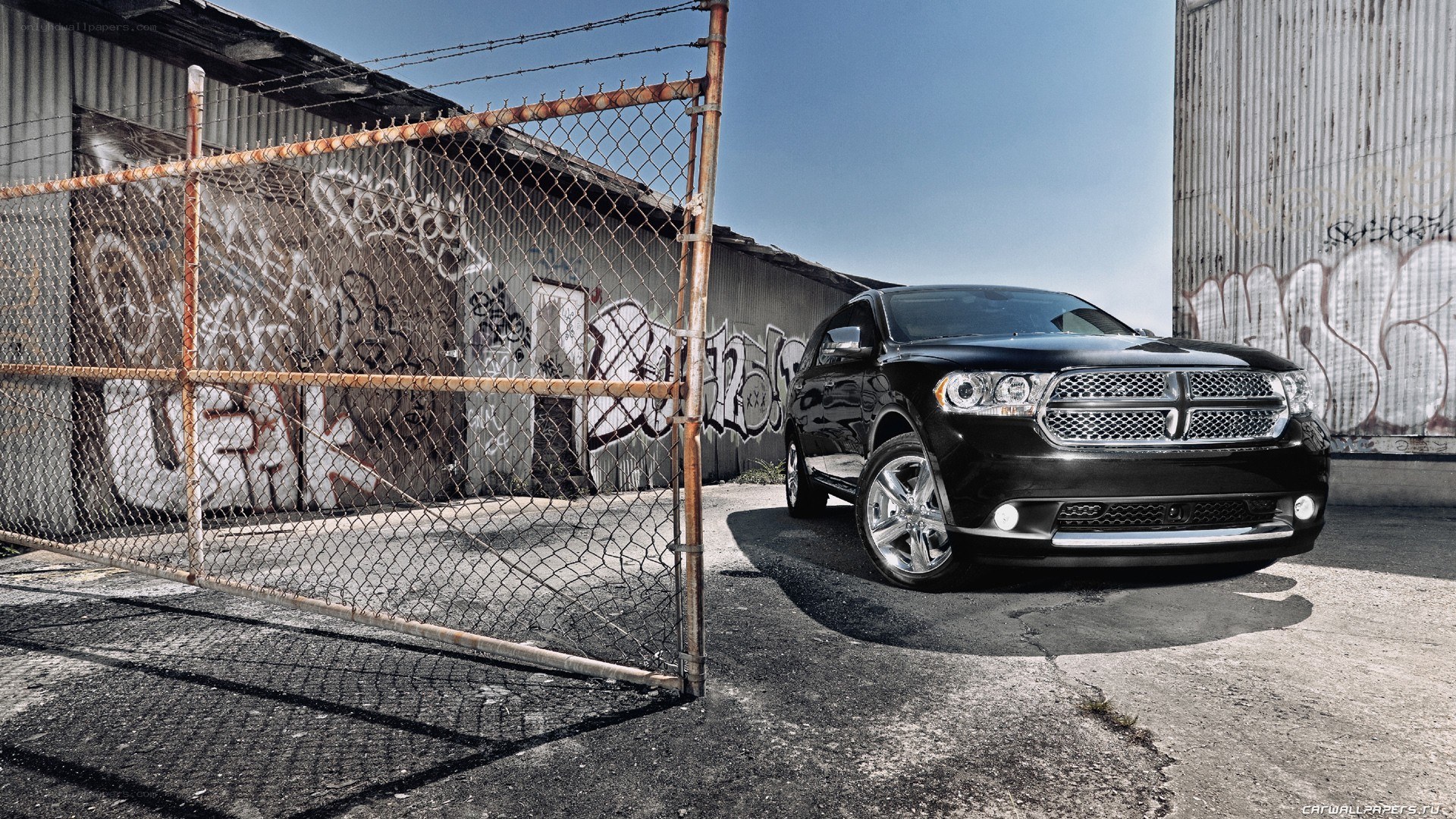 Black Dodge Durango in industrial area