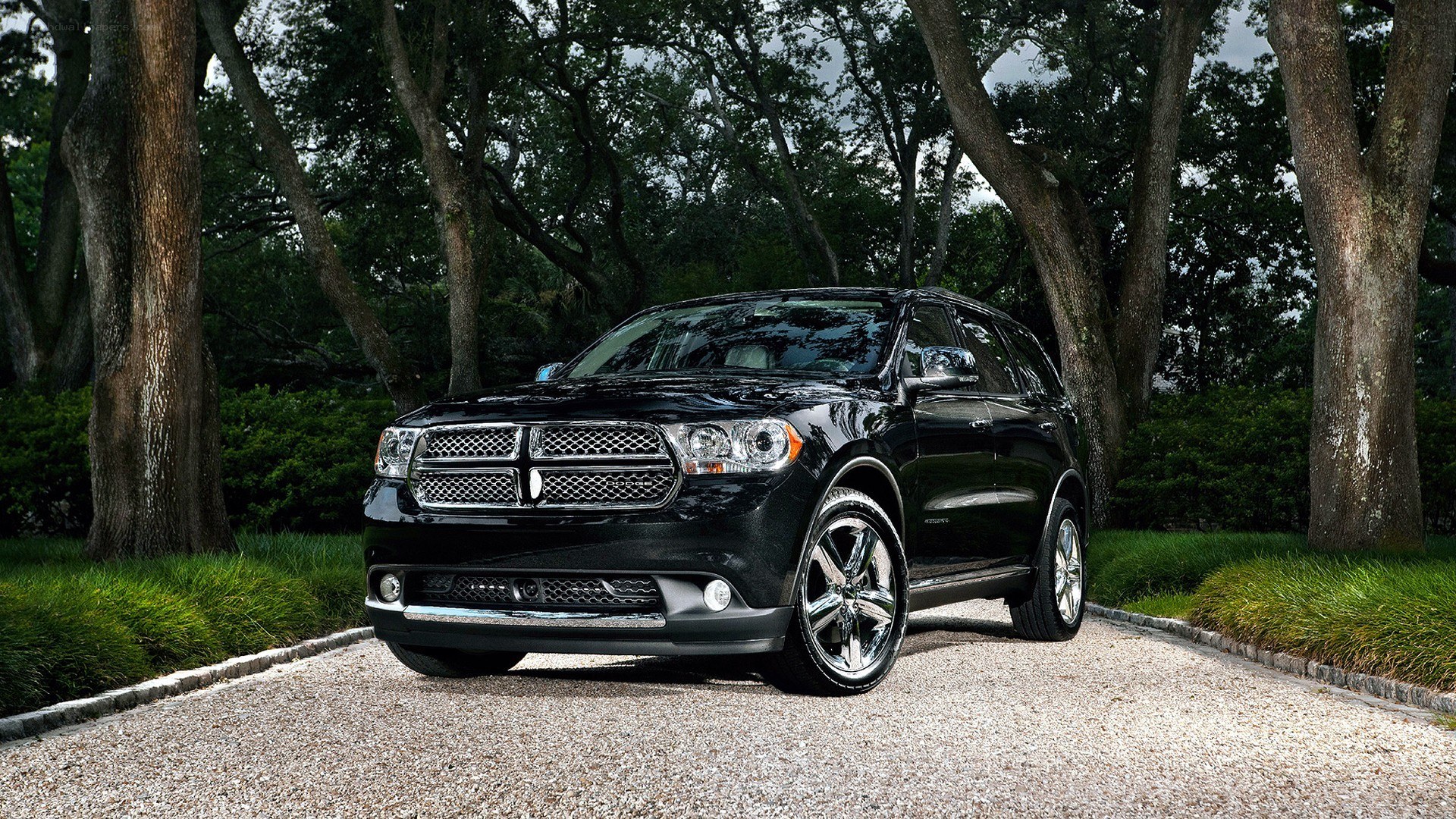 Black Dodge Durango on gravel path