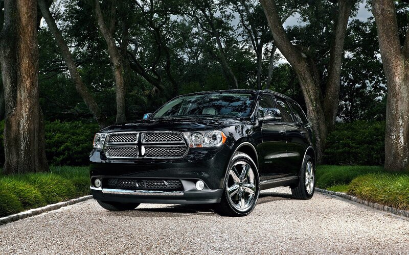Black Dodge Durango parked on gravel
