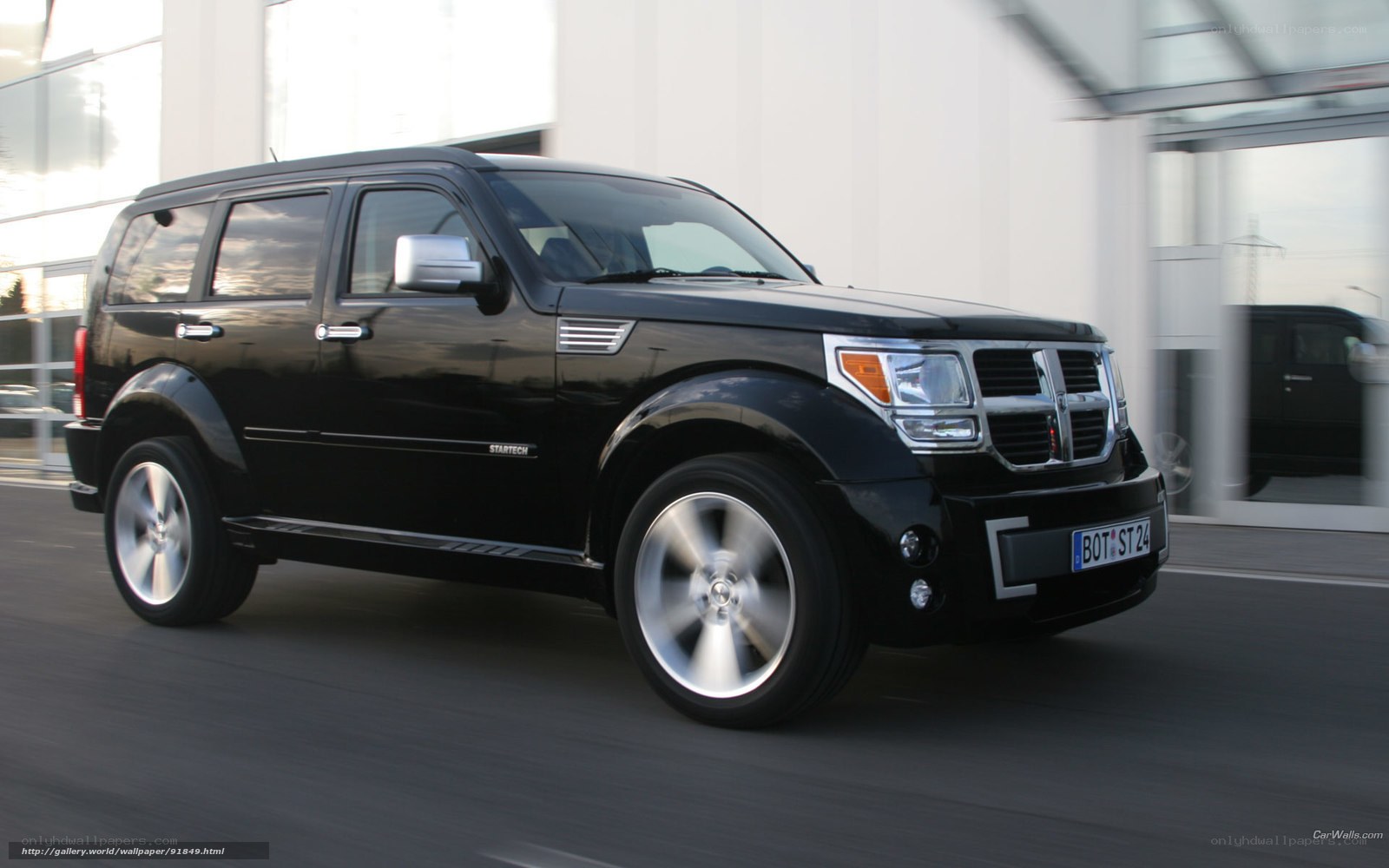 Black Dodge Nitro in motion