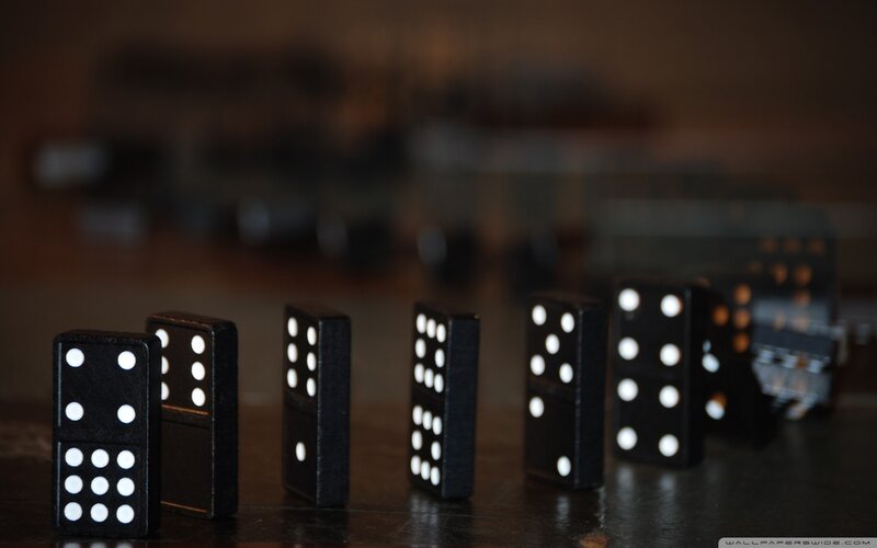 Black Dominoes in Line — Dramatic