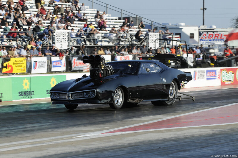 Black Drag Racing Car — Dynamic, Afternoon, Photograph, Crowd, Racetrack