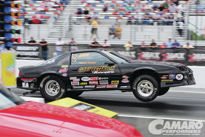 Black Drag Racing Car — Dynamic, Afternoon, Photograph, Crowd