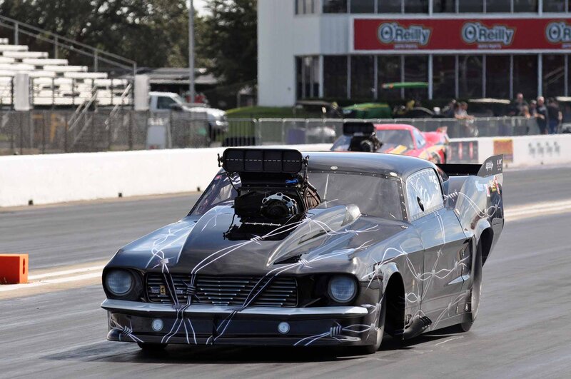Black Drag Racing Car — Dynamic, Afternoon, Photograph, Race Track, Spectators