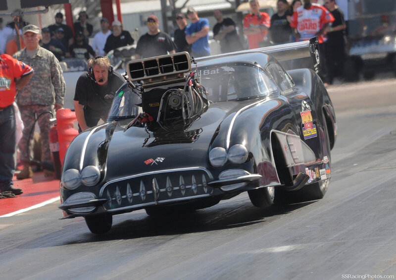 Black drag racing car on track