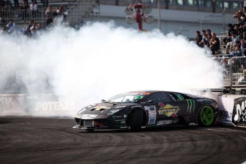 Black Drift Car — Dynamic, Afternoon, Photograph, Crowd