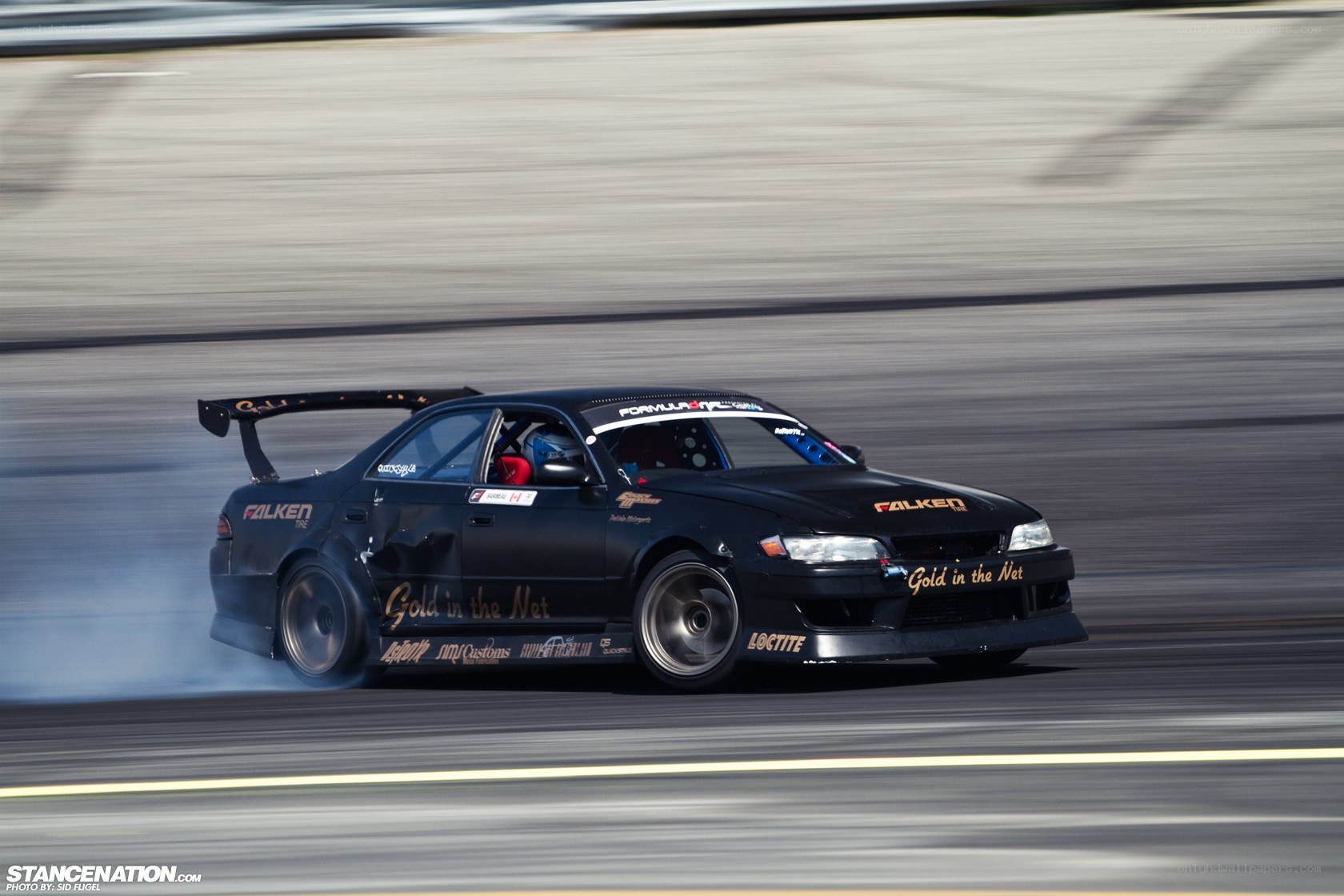 Black drift car on track