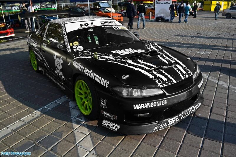 Black drift car with green wheels