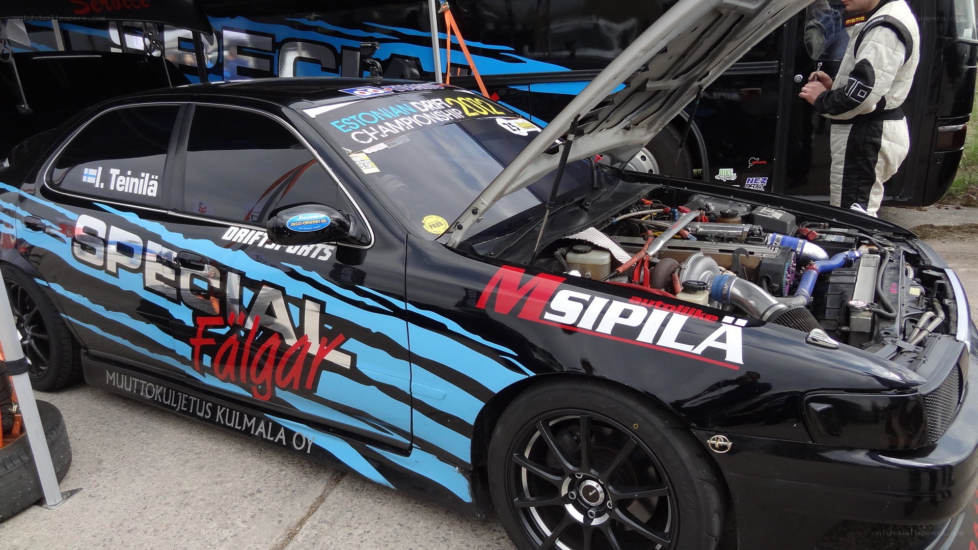 Black drift car with open hood