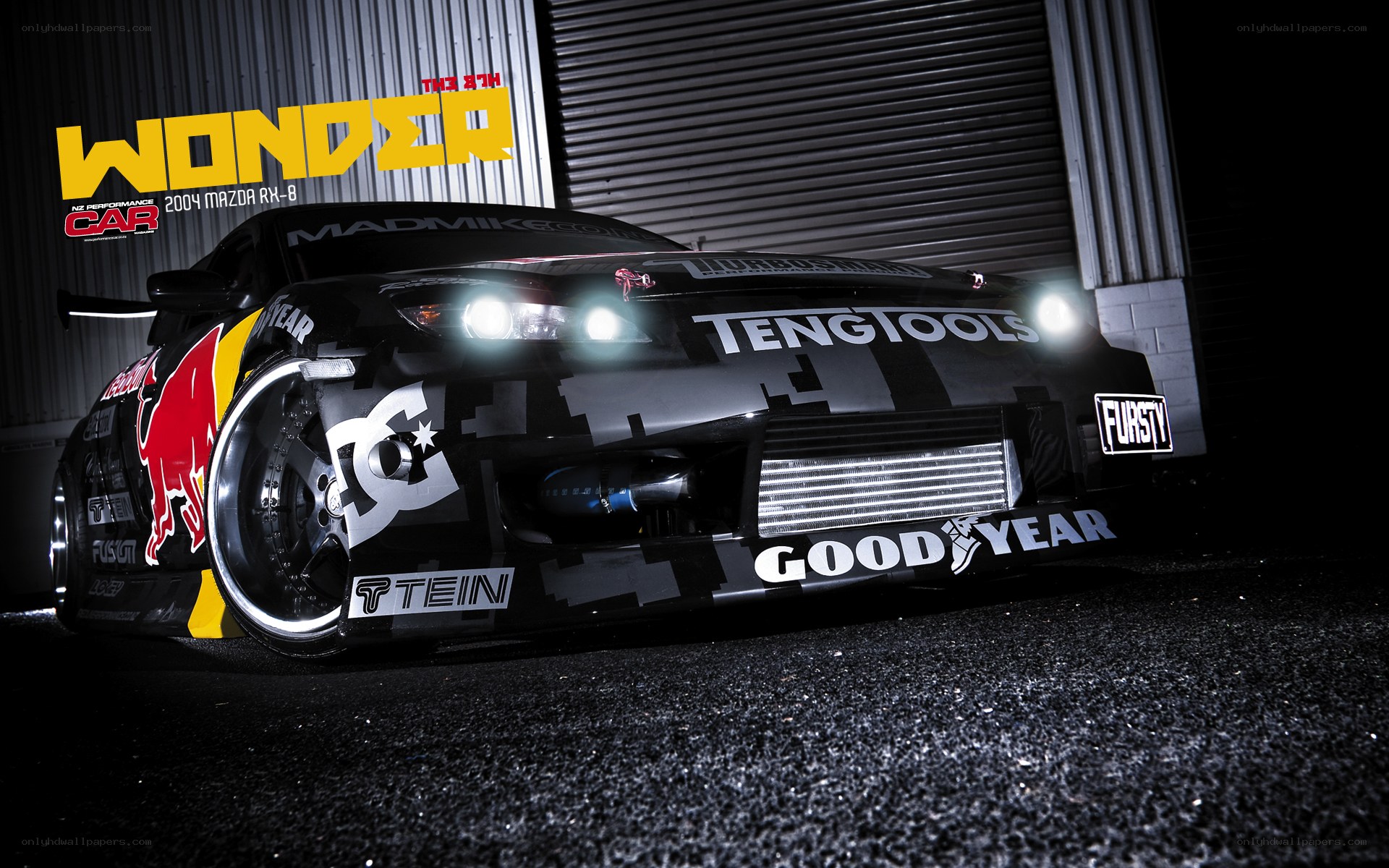 black drift car with sponsor logos
